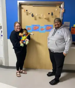 Parents Sarah and Kevin Hernandez pose for a photo with their 6-month-old, Eden, on the morning of her transplant at St. Louis Children's Hospital on January 18th, 2024.