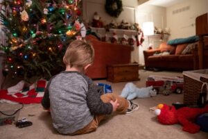 A foster child in the care of Andy and Erin Bryan plays with toys inside their home in Chesterfield.